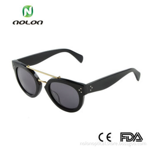 Acetate sunglasses in black with gold metal